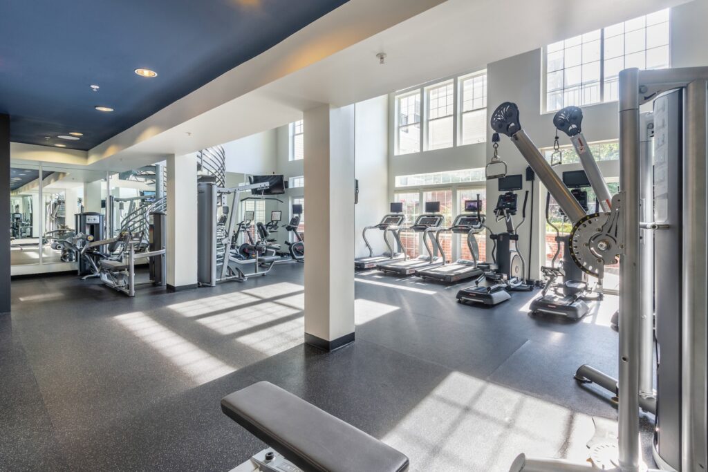 First story of the gym with cardio and strength equipment and lots of natural light.